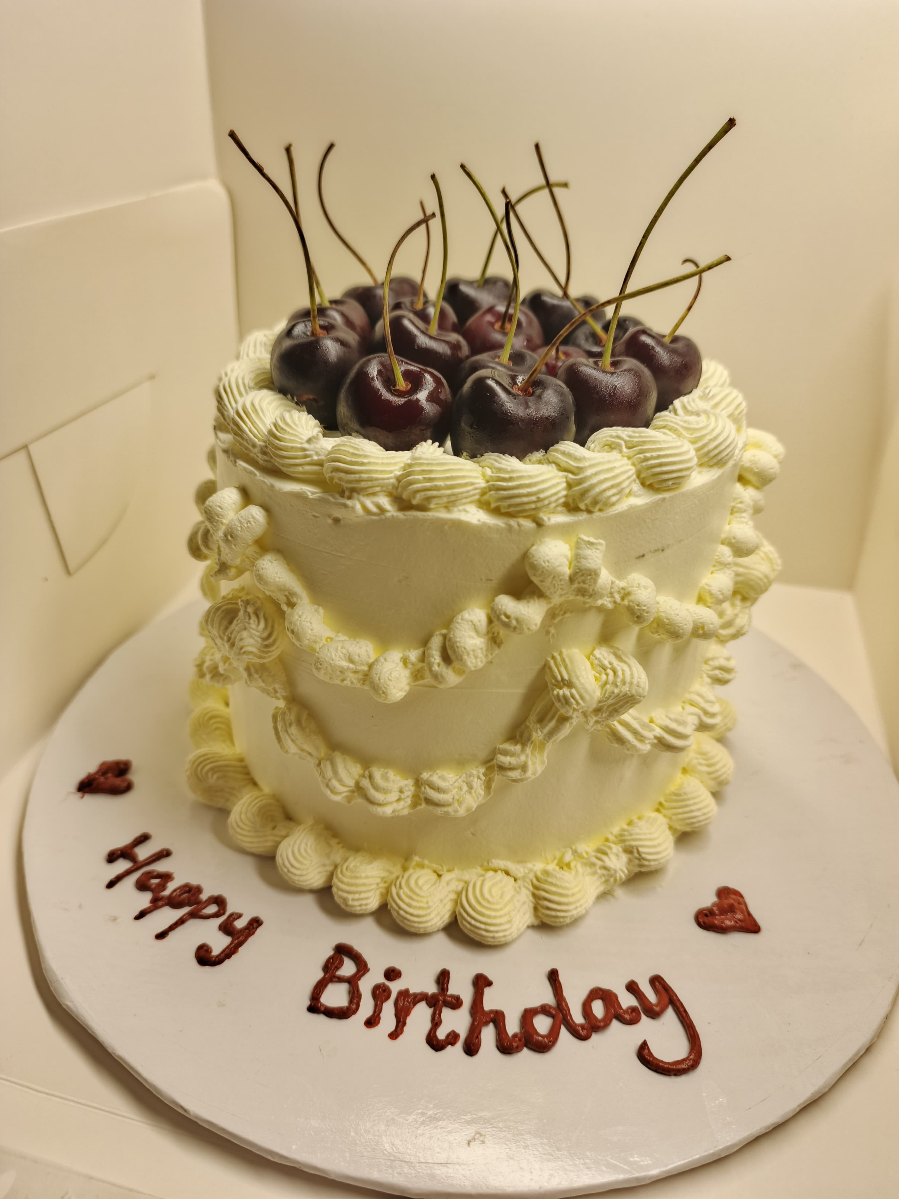 Vintage cherry topped chocolate fudge cake
