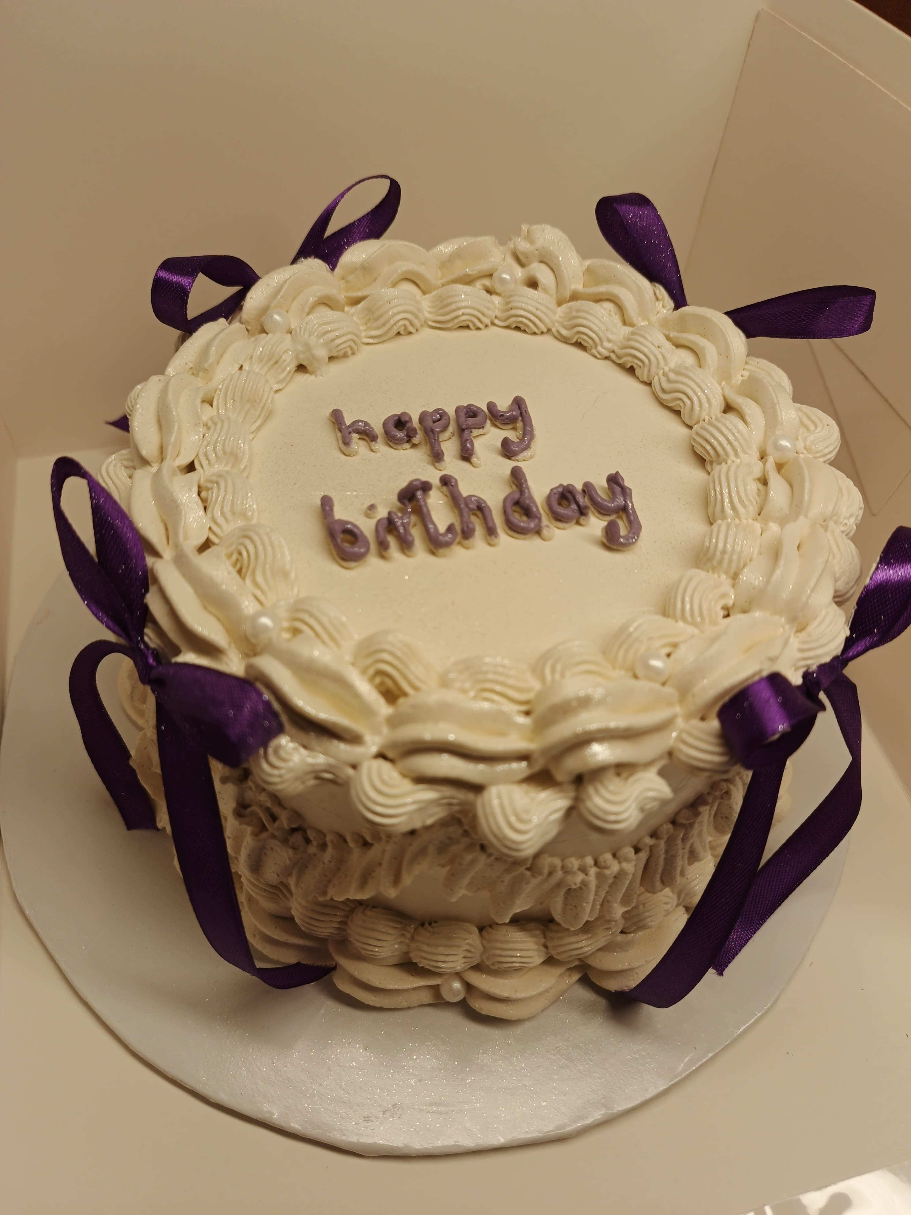 Vintage cake with purple ribbon bows